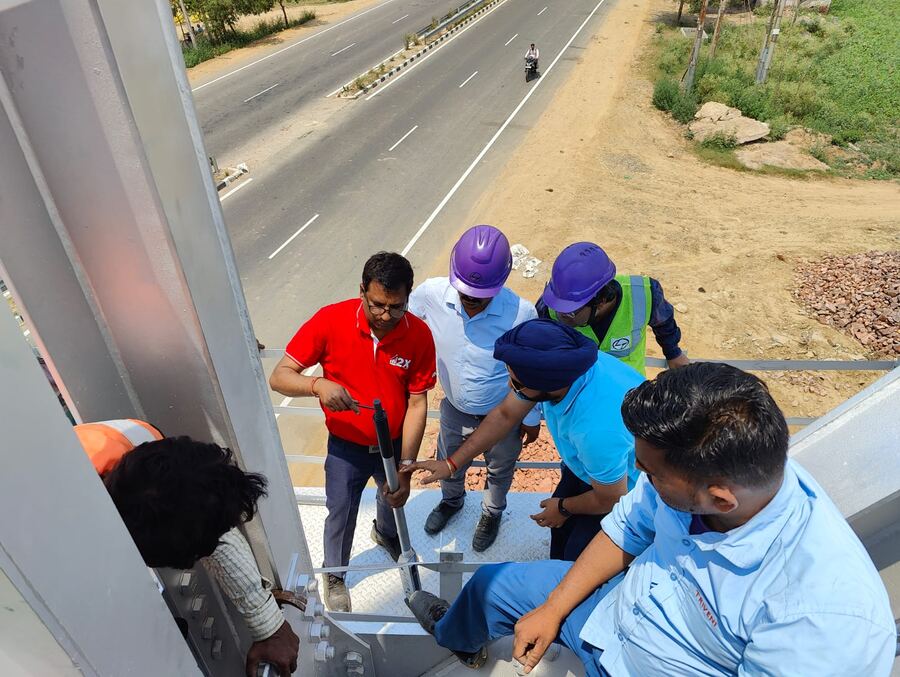 Torque application by the site engineering team on a structure spanning a highway